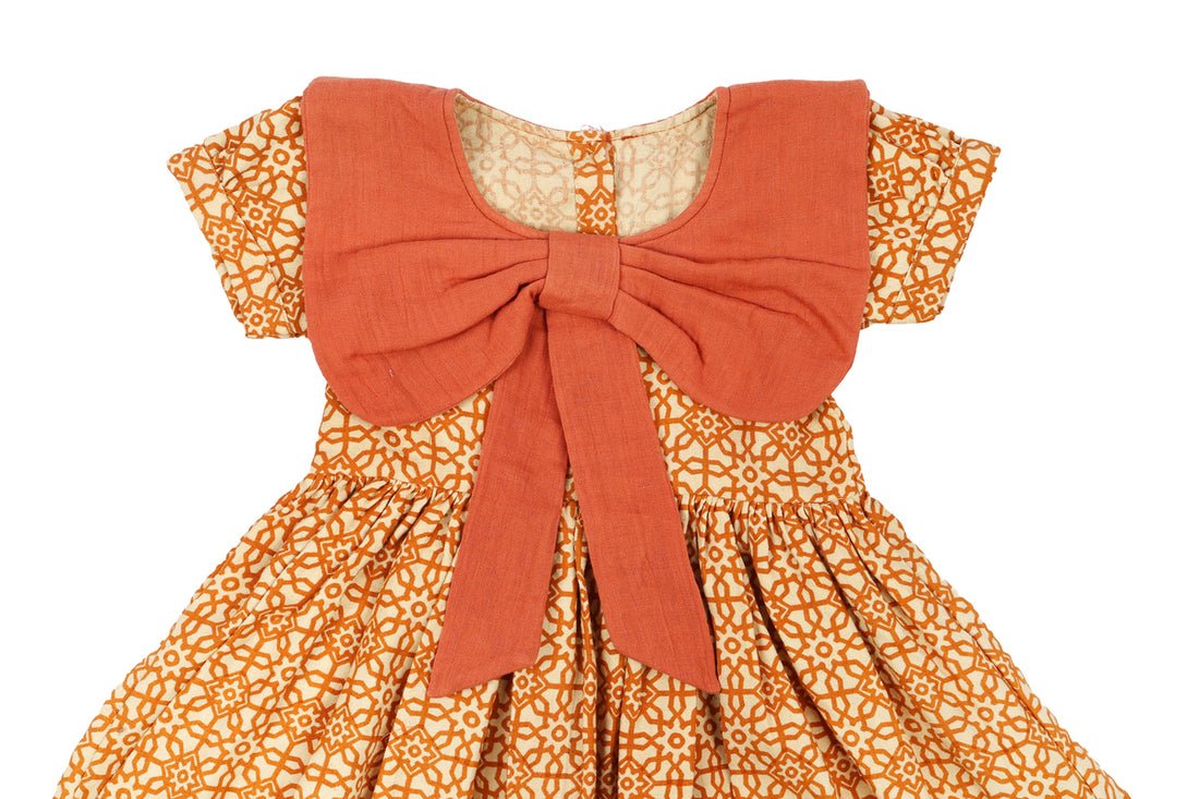 Girls Orange Printed Dress with Bow Detail